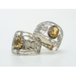 [Scottish market] A pair of silver and citrine D-section napkin rings by Joseph Cook & Son