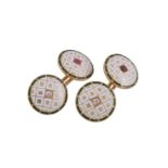 A pair of early 20th century diamond and ruby set enamelled cufflinks