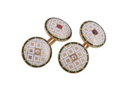 A pair of early 20th century diamond and ruby set enamelled cufflinks