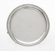 A silver circular waiter by R. Hodd & Son