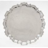 A late Victorian silver shaped circular salver by Thomas Bradbury & Sons