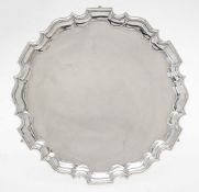 A late Victorian silver shaped circular salver by Thomas Bradbury & Sons