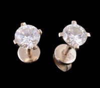 A pair of diamond single stone ear studs