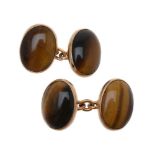 A pair of tiger's eye cufflinks