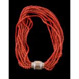 ϒ A multi strand coral bead necklace