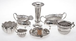 A silver oval sugar bowl and cream jug by John Taylor & Co.