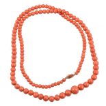 ϒ A graduated coral bead necklace