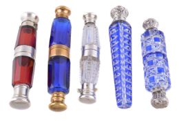 Four double ended glass scent bottles and one tapered