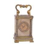 A brass cased miniature carriage clock