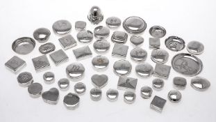 A collection of silver coloured small boxes