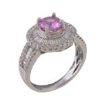 A pink sapphire and diamond cluster ring