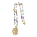 ϒ An 18 carat gold and gem set pendant and necklace by Torrini