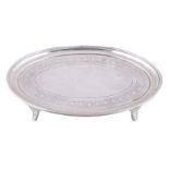 A George III silver oval tea pot stand by Charles Chesterman II