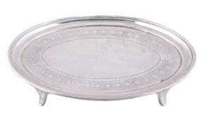 A George III silver oval tea pot stand by Charles Chesterman II