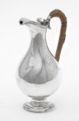 An Edwardian silver baluster ewer by Harman & Co.