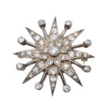 A diamond star brooch