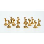 A set of twelve Italian silver gilt figural menu holders by Fabbrica Argenteria Fiorentina