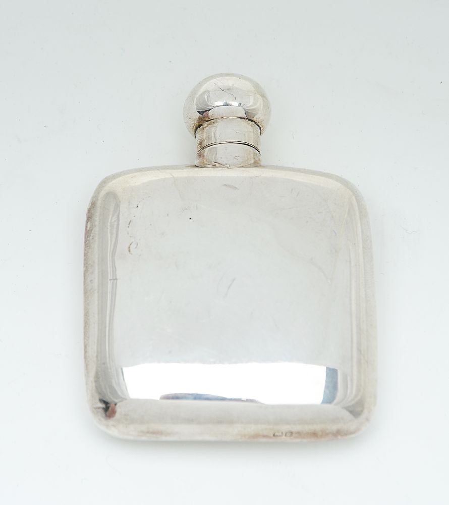 A silver rounded rectangular small spirit flask by Cohen & Charles