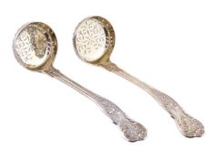 A pair of Victorian silver gilt Bright Vine pattern sugar sifting spoons by George Adams