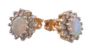 A pair of opal and diamond cluster earrings