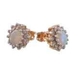 A pair of opal and diamond cluster earrings