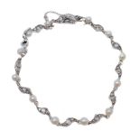 A pearl and diamond bracelet