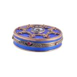 A Continental gold coloured, enamel and gem set circular box