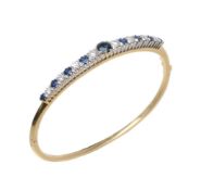 A sapphire and diamond hinged bangle