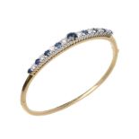 A sapphire and diamond hinged bangle