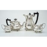 A matched silver oblong baluster four piece tea service