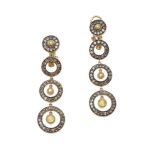 A pair of diamond and yellow sapphire earrings
