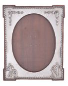 An Edwardian silver photograph frame by William Comyns & Sons