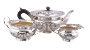 A matched silver compressed spherical three piece tea service