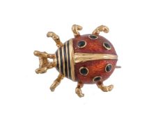 An 18 carat gold ladybird brooch