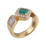 An emerald and diamond ring