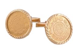 A pair of Saudi Arabian gold coloured coin cufflinks