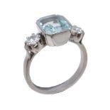 An aquamarine and diamond three stone ring