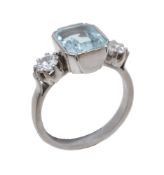 An aquamarine and diamond three stone ring