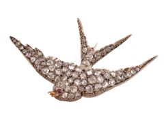 A late Victorian diamond and ruby swallow brooch