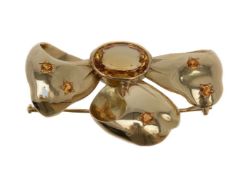 A citrine bow brooch