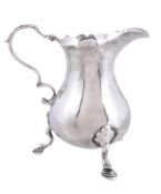 A late George II silver baluster cream jug by Walter Brind