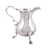 A late George II silver baluster cream jug by Walter Brind