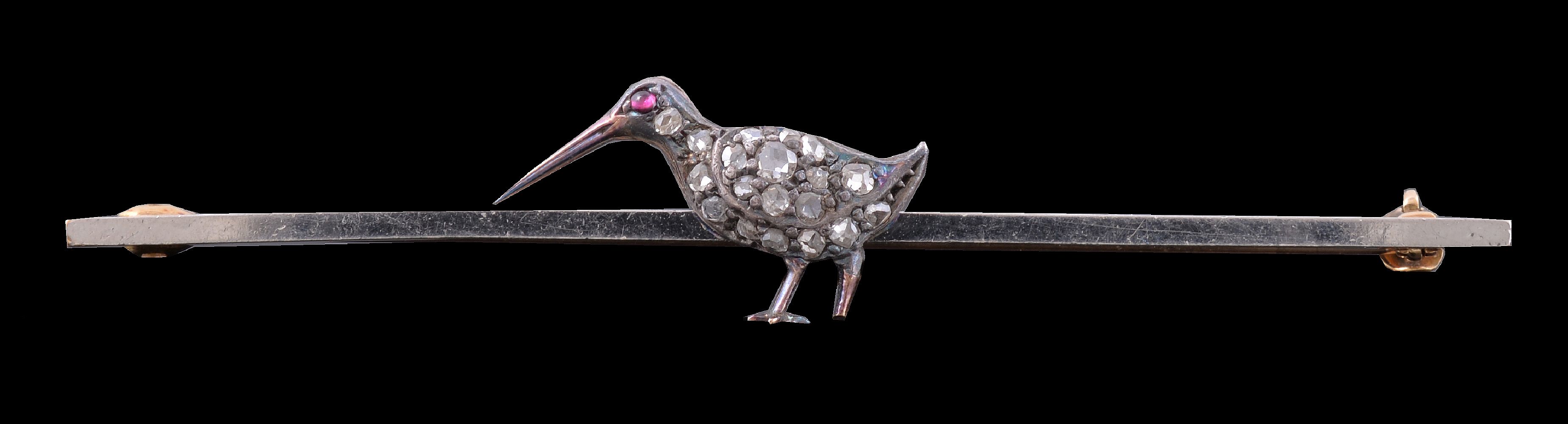 A diamond and ruby snipe bar brooch