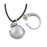 A South Sea cultured pearl, diamond, ruby and emerald cat pendant
