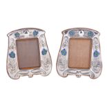 A pair of matched Arts and Crafts silver photograph frames