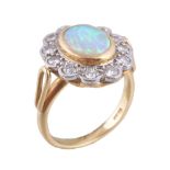 An 18 carat gold opal and diamond cluster ring