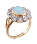 An 18 carat gold opal and diamond cluster ring