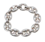 A silver bracelet, the polished links to a ring bolt clasp