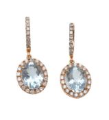 A pair of aquamarine and diamond earrings