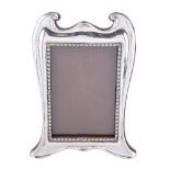 An Edwardian silver photograph frame, maker's mark worn, Birmingham 1908